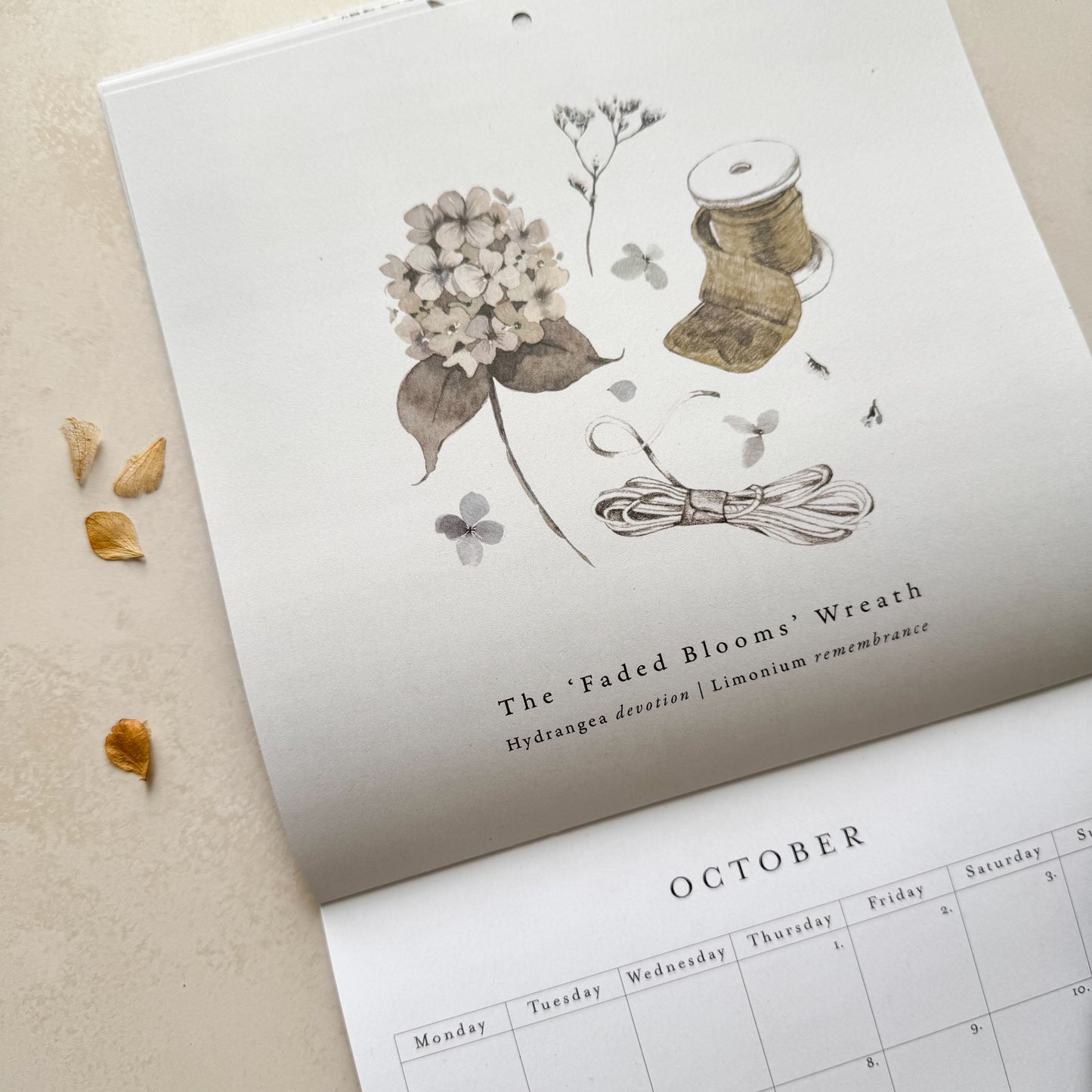 Calendar with floral design and text on a beige background
